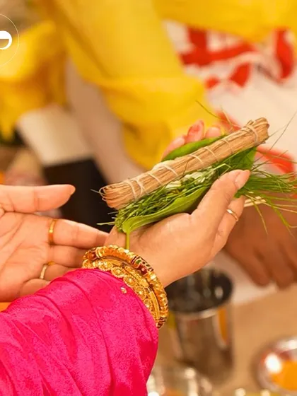 A close up of the mother to be's hands during a traditional Godhbarai ritual. This intimate moment, rich in culture and emotion, is a beautiful representation of the blessings being showered upon her and the baby.