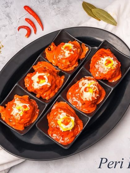 Our Peri Peri Balls are bite sized chicken starters packed with flavour. Minced chicken is seasoned with spicy peri peri masala, shaped into balls, and cooked in a rich, tangy gravy.
