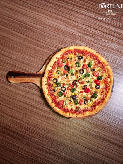 Our vegetarian pizza, seen from above, is a colorful medley of fresh vegetables on a perfectly baked crust.