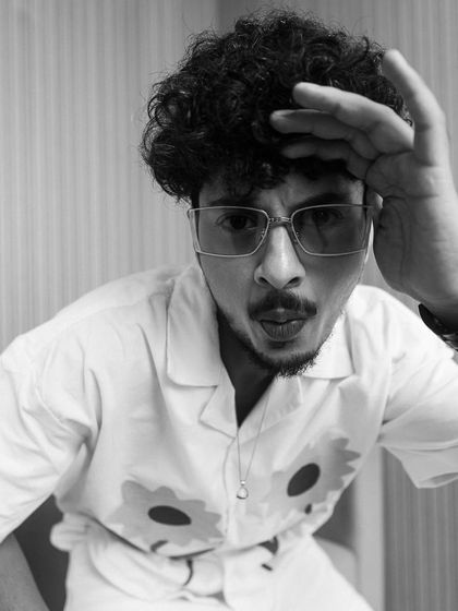 A playful black and white portrait of one of the actors from the Kota Factory promotions.