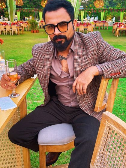 Dressed sharp, thoughts sharper. Taking a moment to relax before a big event, but always thinking about the music.