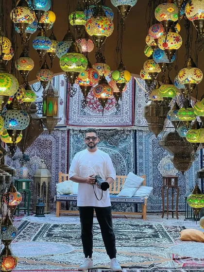 A portrait of me in the lamp shop, a place of endless inspiration.