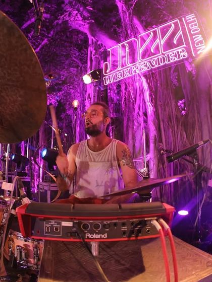 A close-up, fish-eye view of a drummer in full flow at the Jazz Weekender. We ensure high-quality production to support the incredible musicianship on display.