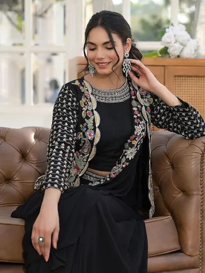 This black draped saree with an embroidered jacket is a perfect example of my Indo-Western collection. It's a modern, chic, and comfortable outfit that is perfect for cocktail parties or receptions.