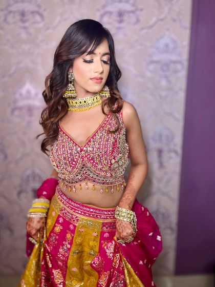 A playful pose showing off the beautiful lehenga and the subtle, elegant makeup.