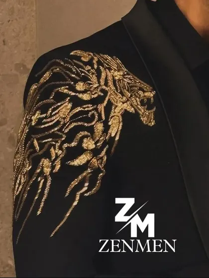 The details are where the magic happens. This is a close-up of a hand-embroidered golden tiger motif on a black tuxedo, a symbol of power and confidence that I can custom design for your outfit.