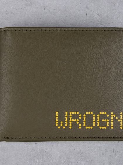 A front view of the olive green wallet with a distinctive yellow dotted brand logo.