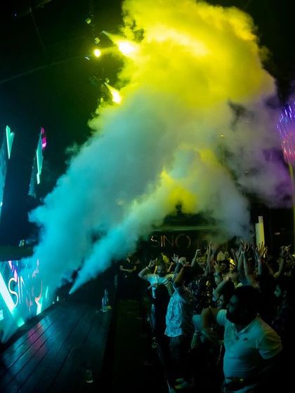 The view from the console as smoke cannons envelop the dance floor at SinQ Nightclub. I use these effects to create a sense of immersion and energy.