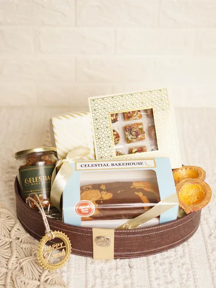 This angle of the 'Royal Basket' highlights the delicious marble tea cake and the box of assorted handmade mithai.