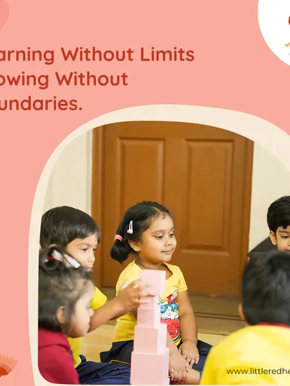 Another moment of focused play, where a child builds a tower with pink blocks. This simple activity is a powerful tool for developing concentration, patience, and spatial awareness.