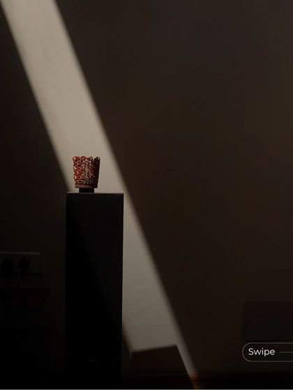 A single beam of light from the skylight dramatically illuminates a small decorative object, turning a simple moment into a work of art. This is the power of designing with light.