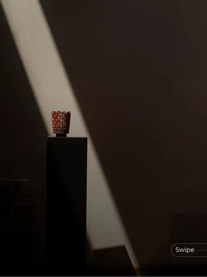 A single beam of light from the skylight dramatically illuminates a small decorative object, turning a simple moment into a work of art. This is the power of designing with light.