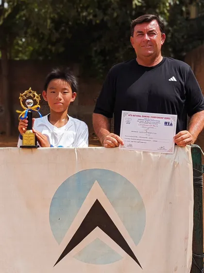Toshinosuke Unami with coach Todd Clark after winning the singles title of the U12 Championship Series tournament in Gurgaon.