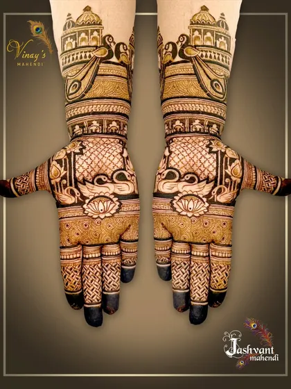 A regal, symmetrical design with swans on the palms and peacocks within jharokhas on the wrists. The dark fingertips provide a classic finish.