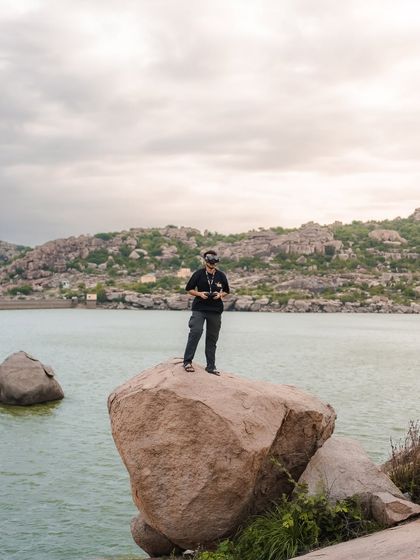 Perched on a boulder by the water, ready to fly. These are the moments that make me feel limitless, where the horizon is endless.