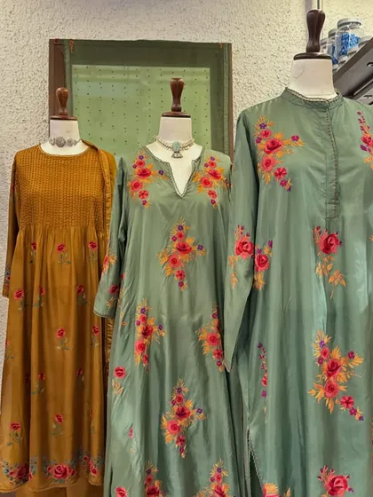 The full trio of these elegant floral kurtas, showcasing the rich colors and beautiful craftsmanship of the Kora collection.