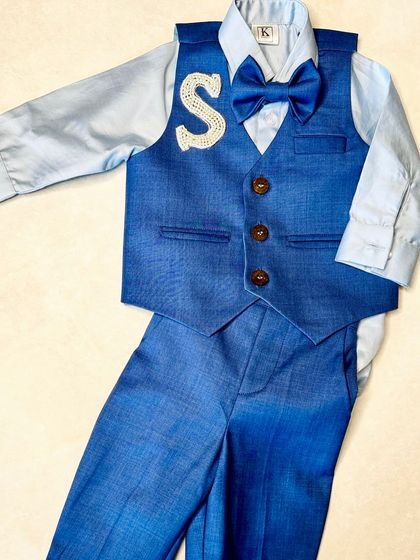 A full view of our custom navy blue suit set for boys, featuring a personalized initial on the vest.