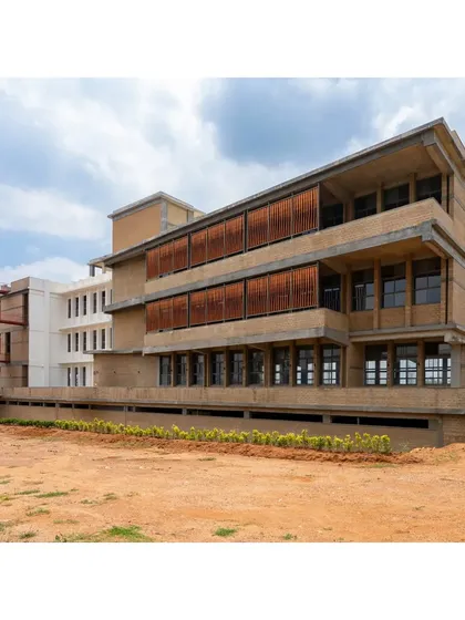 The RSL Office building under construction, showing the combination of exposed concrete frame and earth block infill walls. The design consists of two independent blocks to be built in phases.