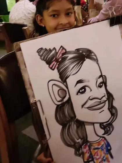 A young girl with her fun caricature.