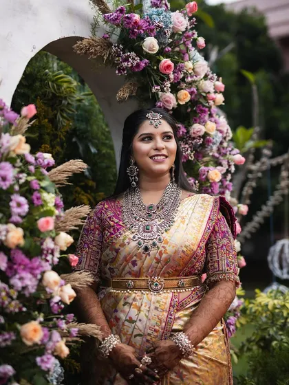 Another shot of the bride at her floral arch, looking absolutely breathtaking.