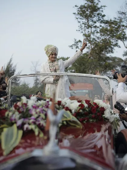 The groom's grand baraat in a vintage Rolls Royce. We handle all the logistics to ensure a smooth and stylish procession.