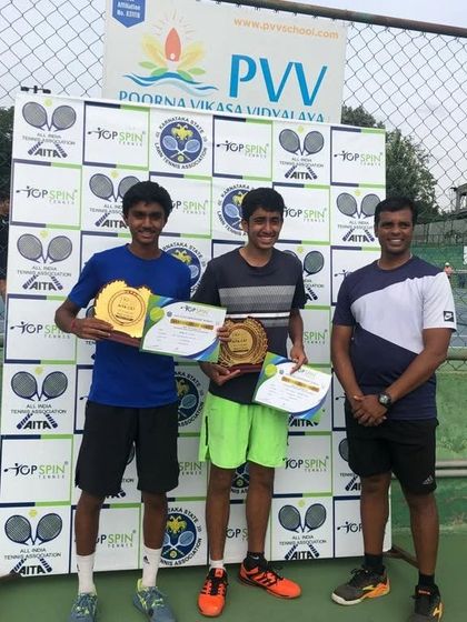 Another angle of our victorious U-18 doubles team, celebrating their hard-earned title.