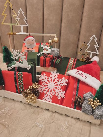Can you hear the jingle bells already? It's my favorite time of the year, and I was thrilled to create this festive Christmas hamper, complete with a personalized Santa hat, for Prithvi Ambani.