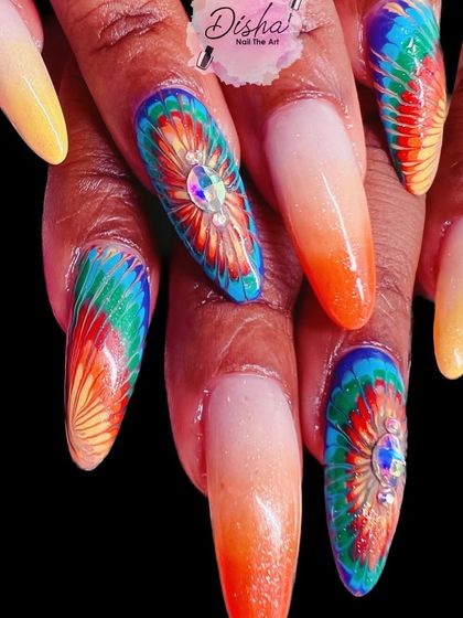 A vibrant and artistic tie-dye design with a central jewel accent.