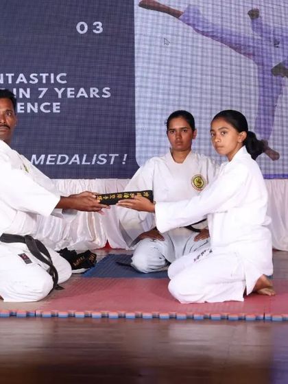 The moment a student receives their Kuro Obi is a sacred tradition. Here, I present a Shodan black belt, recognizing the culmination of years of hard work and perseverance.