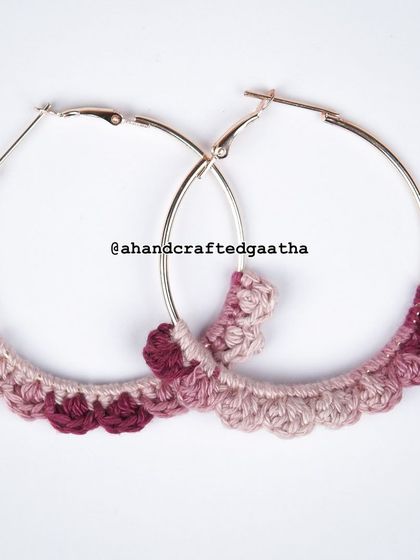 The maroon 'Naazakat' hoops, a rich and elegant color option. This studio shot highlights the ombre effect in the yarn.