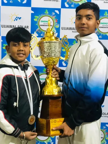 Harsh and Dhanraj, two of my most dedicated students, holding our team trophy. They are future leaders of the dojo.