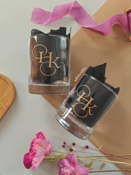 These hand-engraved whiskey glasses feature a custom monogram designed for a couple. It's a classic and elegant gift, perfect for celebrating a special bond.