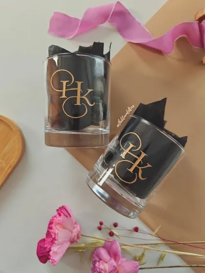 An elegant monogram for a special couple. These hand engraved whiskey glasses feature a custom 'HK' design, making them a sophisticated and personal gift for a wedding or housewarming.