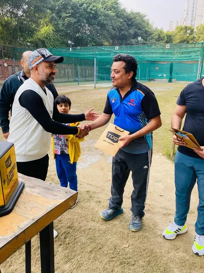 A player receiving his prize at the TUG Blaster awards ceremony. Every contribution to the team's victory is celebrated.