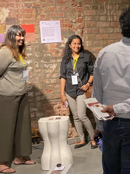 A moment from the 'Intersection' exhibit, where our team discusses the curated works with visitors. Collaboration and conversation are integral parts of our creative process.