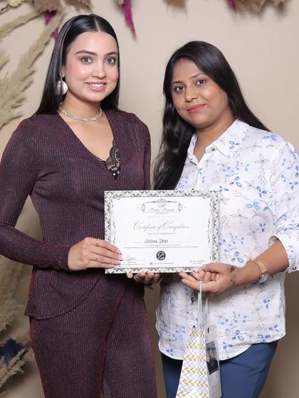 Presenting a certificate to another talented graduate. I provide lifetime support to all my students.