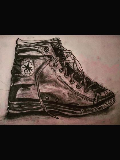 A realistic pencil and charcoal drawing of a Converse shoe. Practice like this helps me improve my skills for commissioned work.