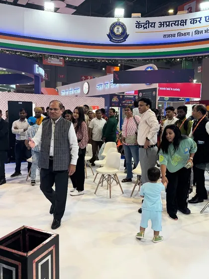 A wide shot of the audience at my Pragati Maidan show. It's a mix of adults and children, all enjoying the performance together.