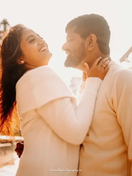 A duplicate image showing a couple's joyful laughter, captured in the warm sunlight of a city afternoon.