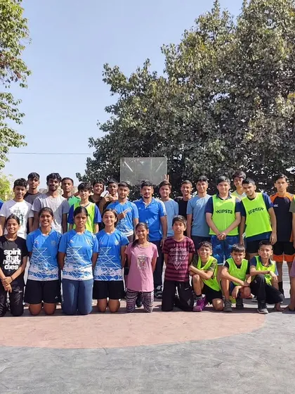 This is our team, our family. This group photo captures the spirit of our academy after a tough practice match. We foster a supportive community where players of all ages come together to push each other and grow.