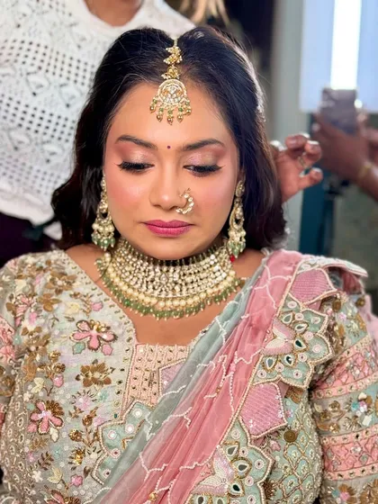 A behind the scenes shot of the makeup application, focusing on the eyes.