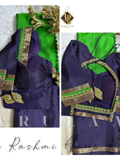 A simple and elegant navy blue blouse with a contrasting green border. The custom latkans are shaped like leaves to match the border design.