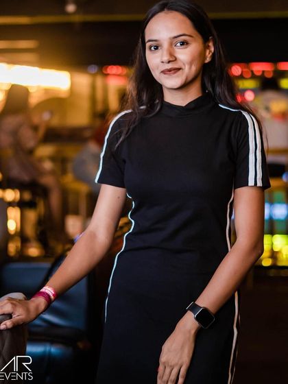 A guest posing at the bar.