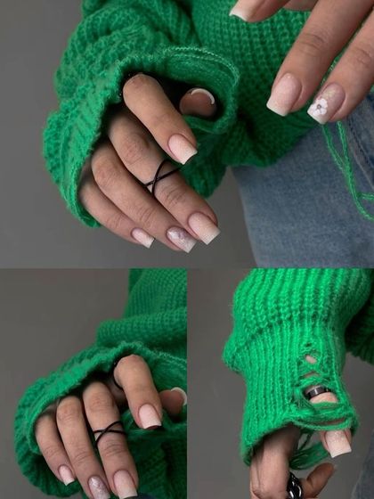 A chic and modern set combining a classic French ombré base with subtle marble and floral accent nails.