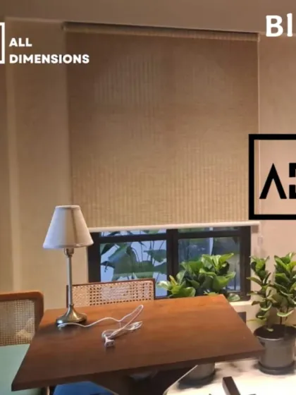 This is a simple and effective roller blind made from a woven, natural material. It provides privacy while still allowing a soft glow of light to pass through, making it ideal for spaces where you want a bright but private feel.