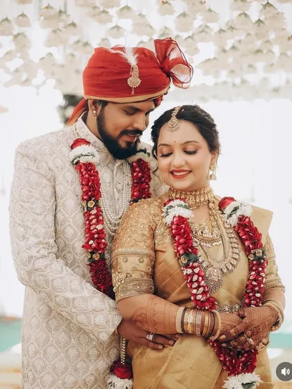 A beautiful couple portrait, showcasing the bride's complete look with her groom.