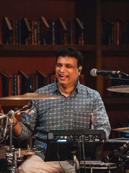 Our drummer, enjoying the moment at Windmills. His smile shows the fun and connection we all share on stage.