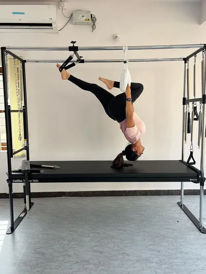 This hanging pose works the obliques and improves spinal rotation while building upper body strength.