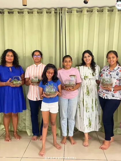 Green thumbs in the making. This group proudly displays the beautiful terrariums they built in our workshop. We provide all the succulents, soil, and glass containers for you to create your own miniature garden to take home.