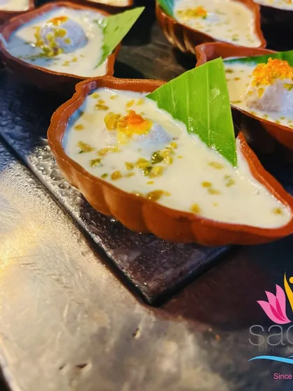 I serve classic Rasmalai in traditional, diya-shaped clay kulhads. This not only enhances the flavor but also adds a rustic, authentic touch to the dessert experience, connecting with our rich culinary heritage.